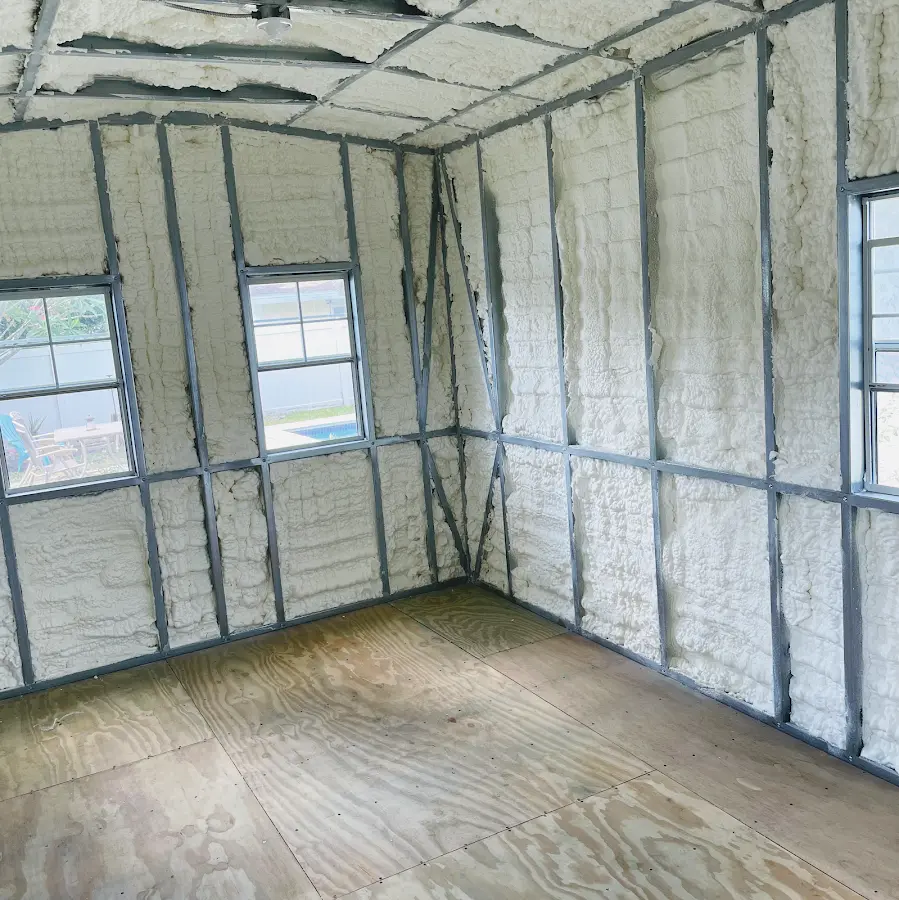 Closed-cell spray foam insulation applied to wall cavities in a residential project in Tulare